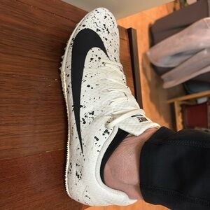 Woman’s Nike track shoes.  Like new with carrying bag!